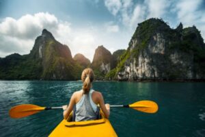 Explore secluded caves and coves while kayaking in Ha Long Bay