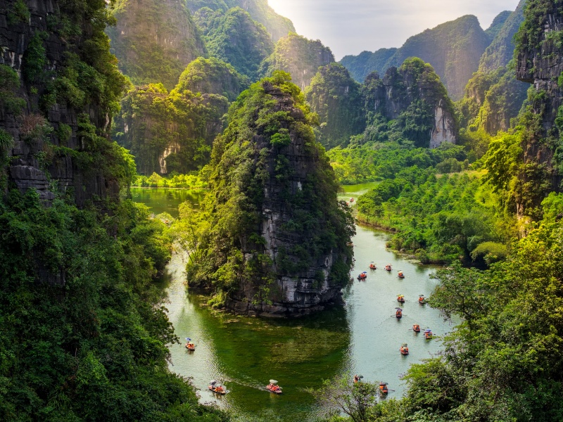 Trang An unfolds worlds: rivers to caves, valleys with temples, light-dark shifts—dramatic Ninh Binh variety!