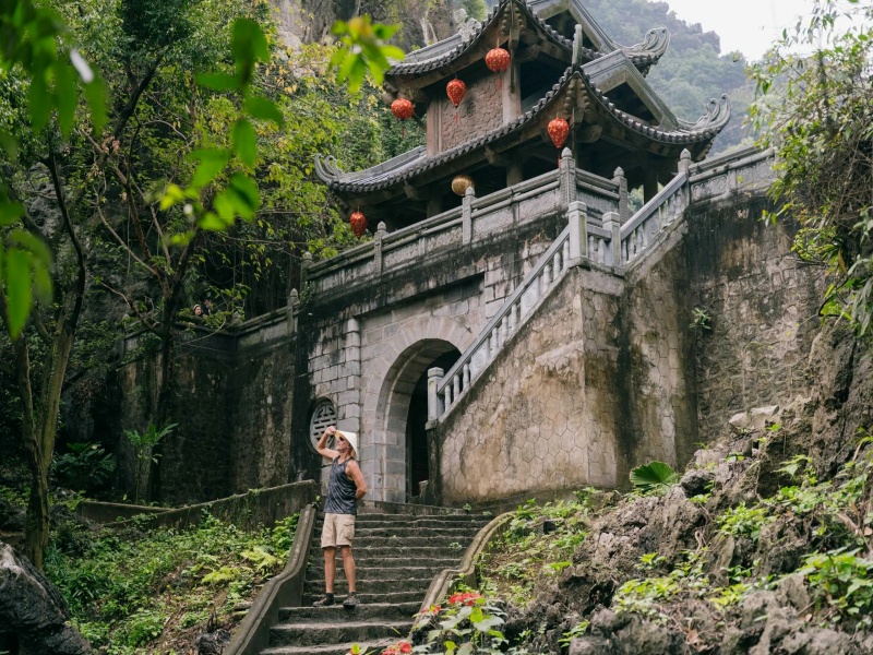Venture into Am Tien Cave Ninh Binh, a captivating destination with transparent waters and lofty limestone walls