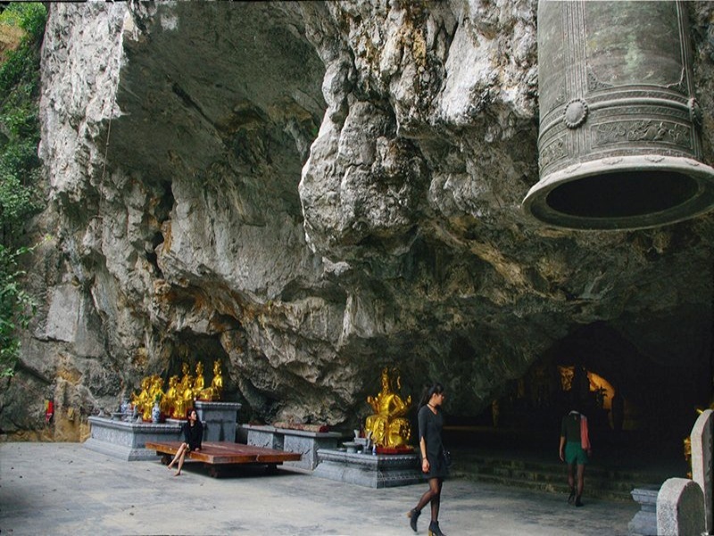 Reach the cave midway up the mountain through a tree-lined stone path, lined with steles celebrating patron contributions