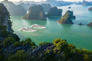 Discover Ha Long Bay's wonders on our premier day cruise - breathtaking islands and turquoise waters await!
