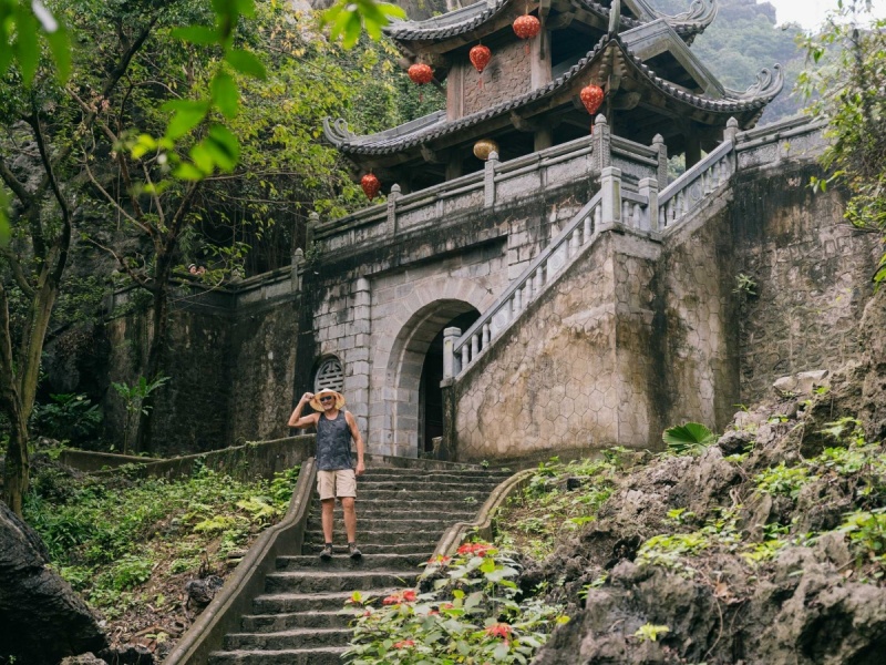 Nestled in a stunning valley, Am Tien Pagoda & Cave dazzles with cliffs, forests, and a serene lake!