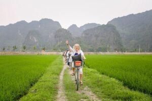 Explore ancient temples and lush rice fields while cycling through Ninh Binh's wonders
