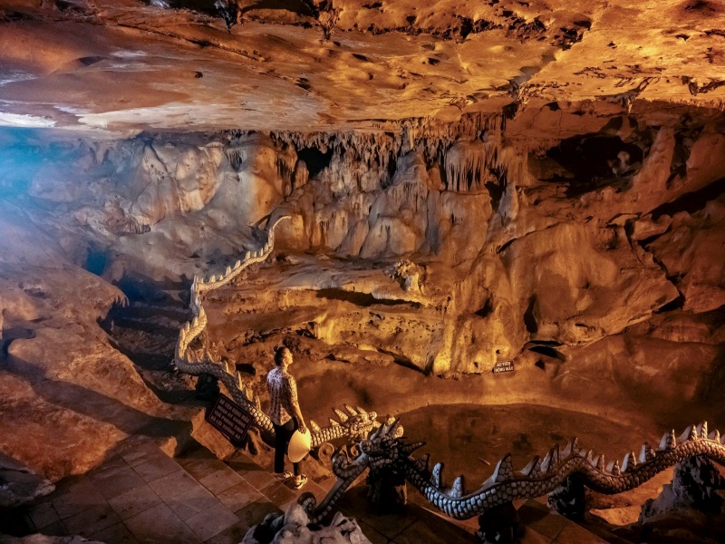 Bai Dinh's Bright & Dark Caves: Stalactite wonders, Buddha statue, mystical vibes near Ninh Binh stream