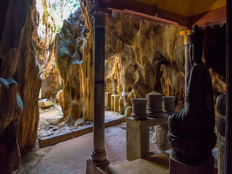Cool 60m Dark Cave at Bich Dong: Nature's artful stalactites craft enigmatic, timeless allure