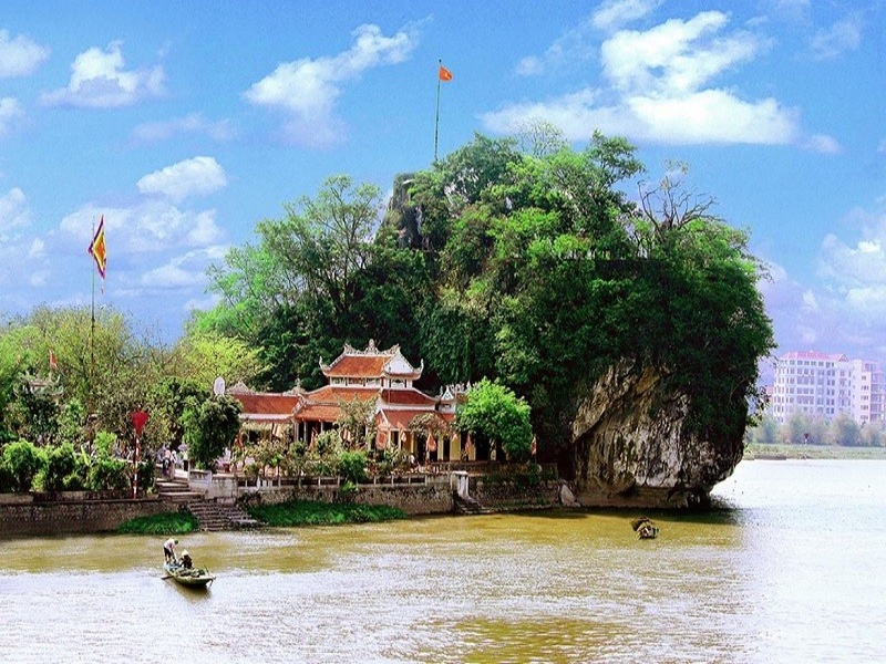 Non Nuoc Pagoda by Day River, in lush greenery, near Ninh Binh landmarks. Easy access.